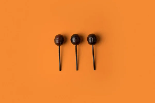 Black halloween lollipops — Stock Photo