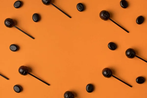 Black halloween lollipops — Stock Photo