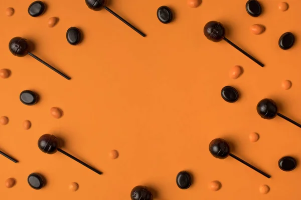 Black and orange lollipops — Stock Photo