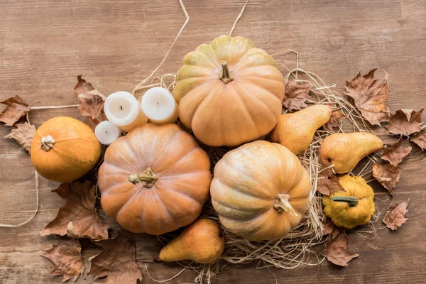 Autumn harvest and candles — Stock Photo