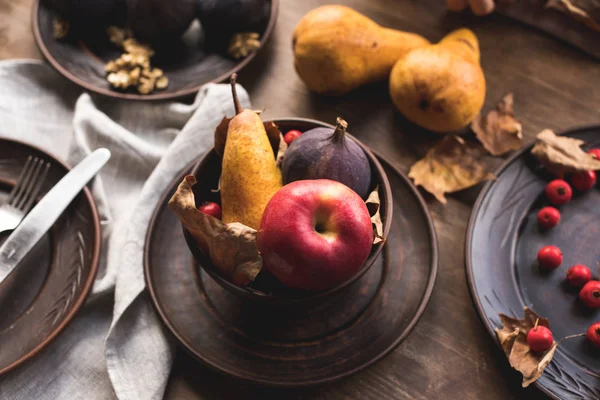 Ripe autumn fruits on table — Stock Photo