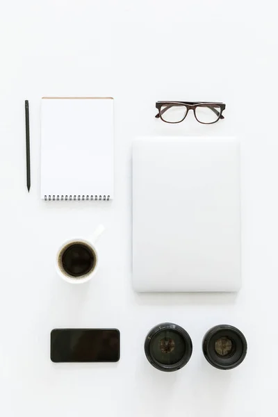 Flat lay with laptop and workplace items — Stock Photo