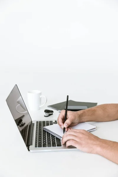 Male hands writing in notebook — Stock Photo