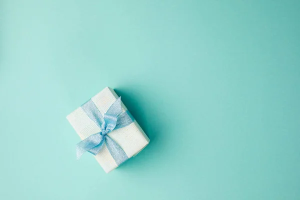 Christmas gift with ribbon — Stock Photo