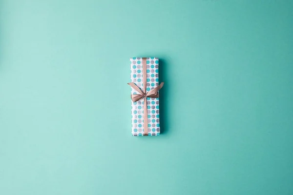 Christmas gift with ribbon — Stock Photo