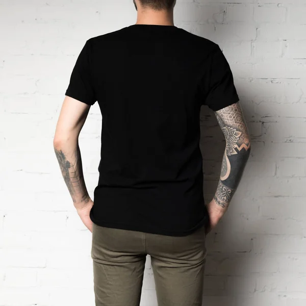 Man in blank black t-shirt — Stock Photo