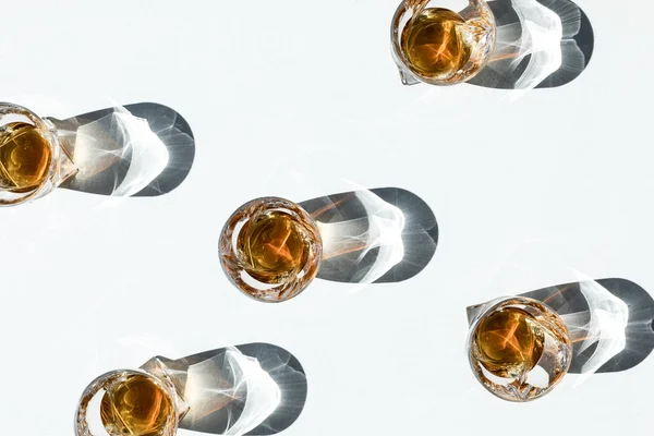 Whiskey in glasses with shadows — Stock Photo