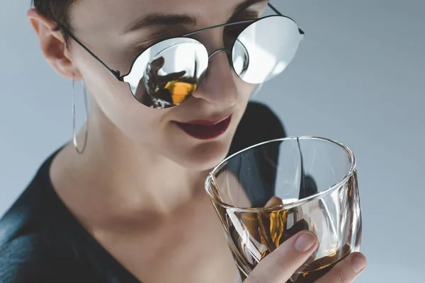 Woman drinking whiskey — Stock Photo