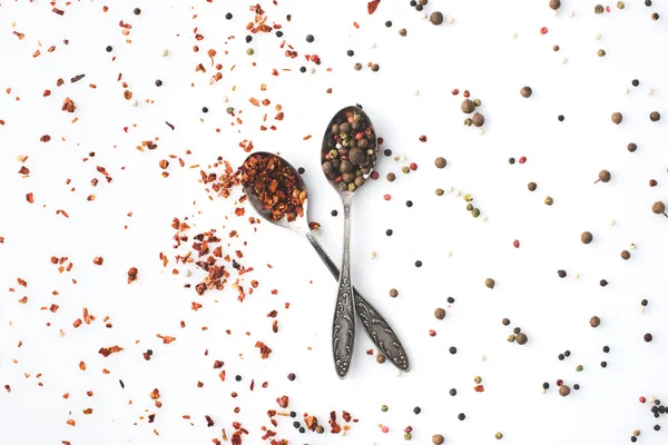 Crossed spoons with pepper — Stock Photo