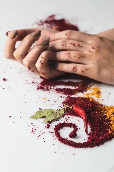 Woman with various spices composition — Stock Photo