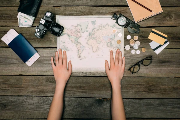 Woman hands on map — Stock Photo