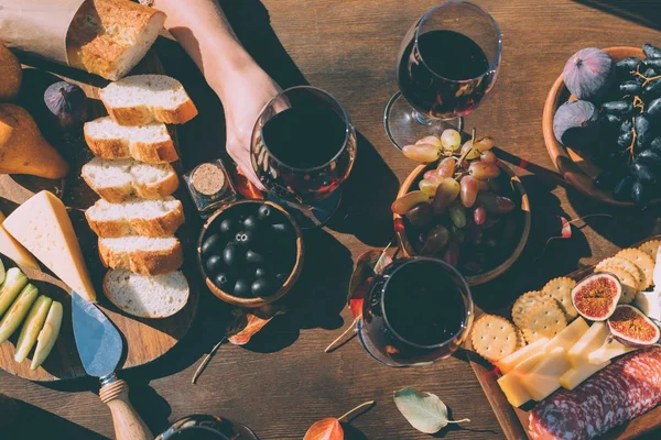 Woman holding glass of wine — Stock Photo