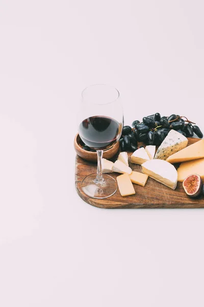 Wine and various snacks — Stock Photo