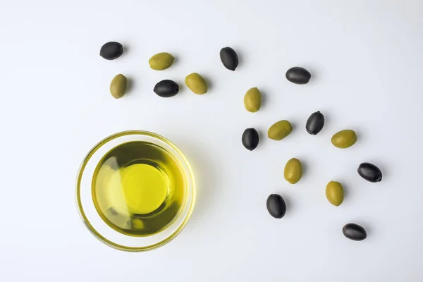 Glass bowl with olive oil — Stock Photo