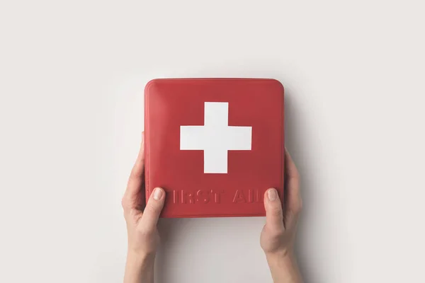 Woman holding first-aid kit — Stock Photo