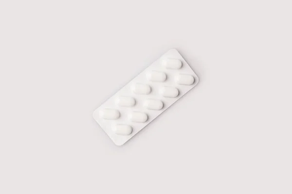 Embalagem blister branca com comprimidos — Fotografia de Stock