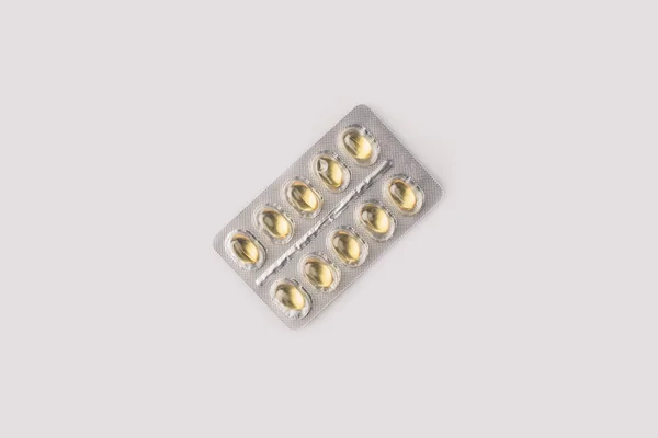 Blister pack with yellow pills — Stock Photo