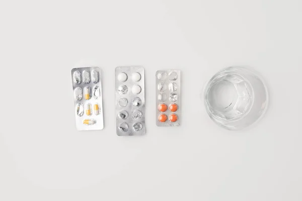 Blister packs with pills and  water — Stock Photo