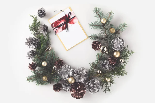 Christmas wreath with greeting card — Stock Photo