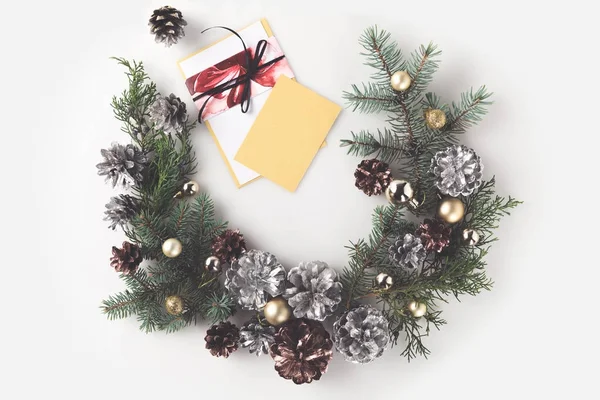 Christmas wreath with greeting card — Stock Photo