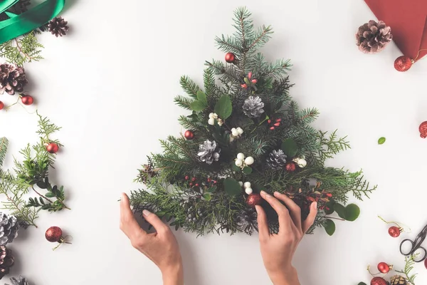 Hand making christmas tree — Stock Photo