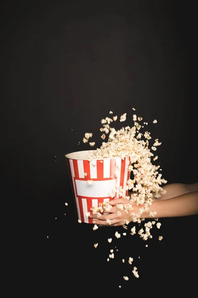 Woman holding bucket of popcorn — Stock Photo