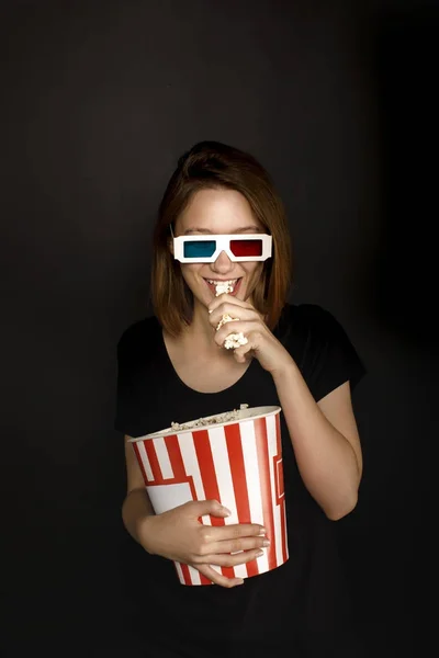 Woman in 3d glasses with popcorn — Stock Photo