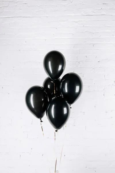 Black shiny balloons — Stock Photo