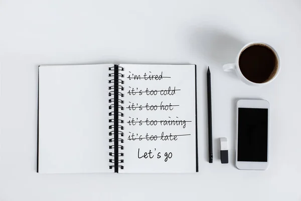 Empty notepad and smartphone — Stock Photo