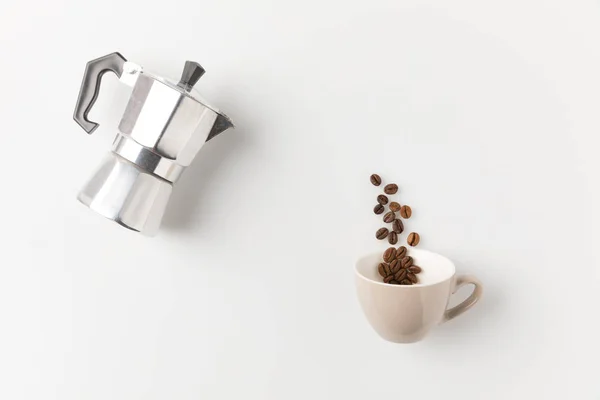 Coffee beans pouring from pot — Stock Photo