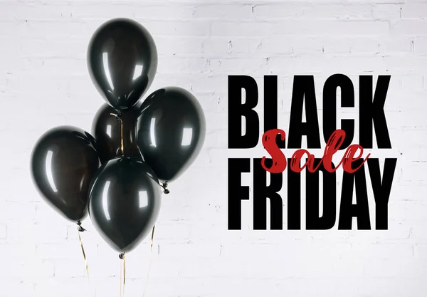 Shiny black balloons — Stock Photo