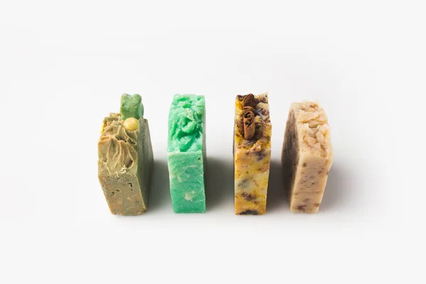 Handcrafted soap standing in row — Stock Photo
