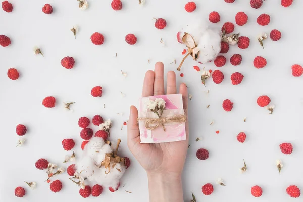 Woman holding berry soap — Stock Photo