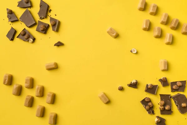 Pieces of chocolate and iris milk candies — Stock Photo