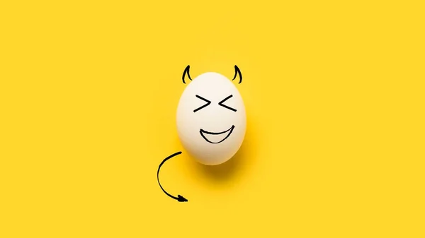 Painted egg with devil — Stock Photo