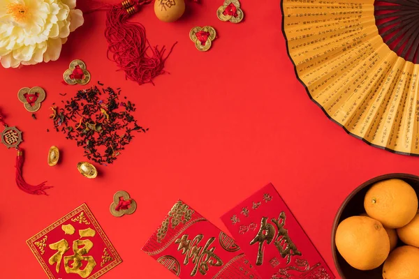 Chinese decorations and tangerines — Stock Photo