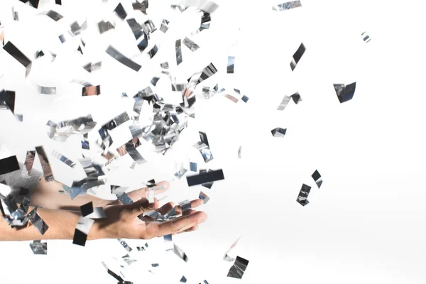 Woman catching falling confetti — Stock Photo