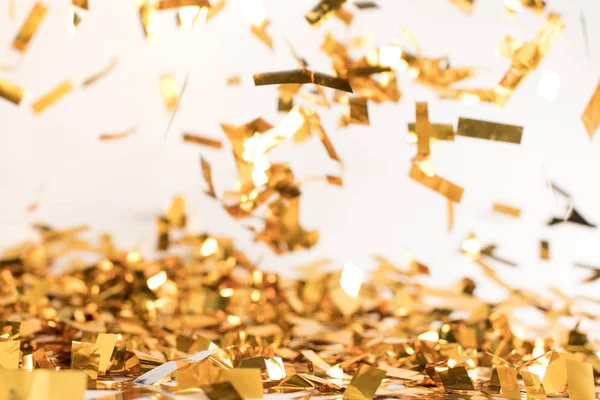 Falling golden confetti — Stock Photo