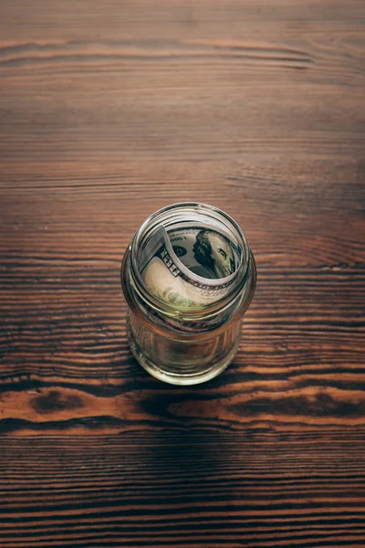 Jar with dollar banknotes — Stock Photo