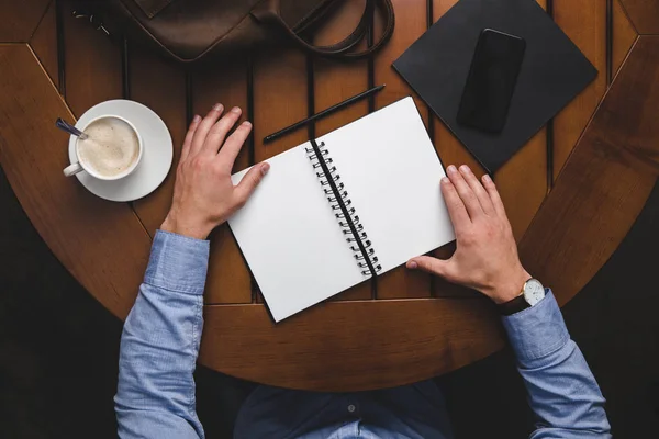 Man with opened notepad — Stock Photo