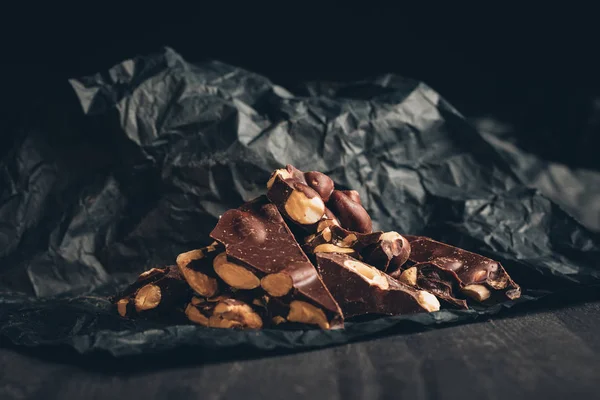 Chocolate on crumpled paper — Stock Photo