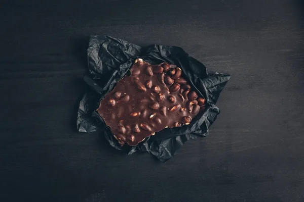 Chocolate on gray wrapper — Stock Photo