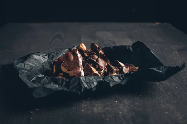 Dark chocolate with nuts pieces — Stock Photo