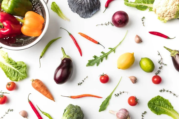 Colander with peppers and vegetables — Stock Photo