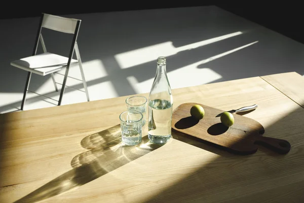 Ingredients for lemonade on table and chair in the kitchen — Stock Photo