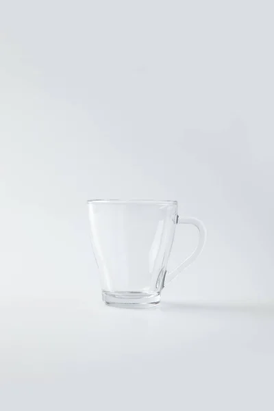 Clear glass cup isolated on white — Stock Photo