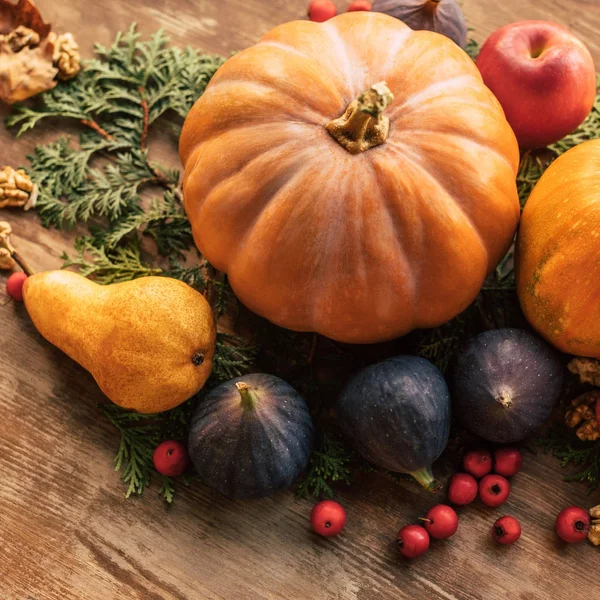 Close-up shot of various fruits and vegetables on wooden table — Stock Photo