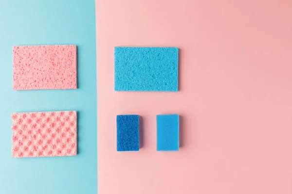 Top view of blue and pink washing sponges, on pink and blue — Stock Photo