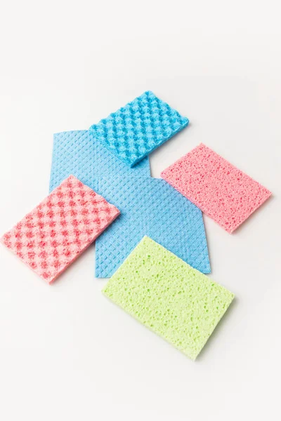 Different colorful washing sponges, isolated on white — Stock Photo