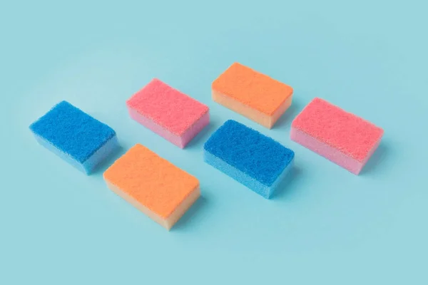 Colorful washing kitchen sponges, on blue — Stock Photo